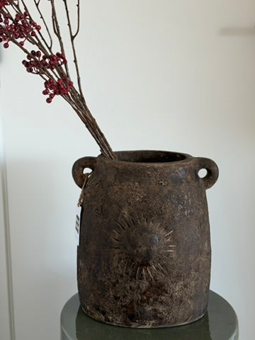Brown stoneware vase with sun detail and handles