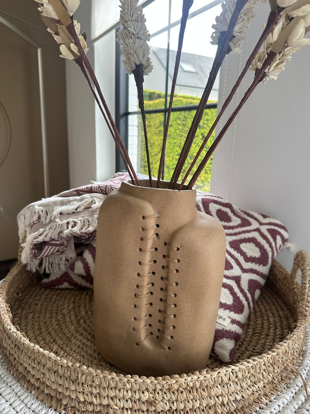 Beige ceramic vase with rope detail