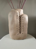 Beige ceramic vase with rope detail