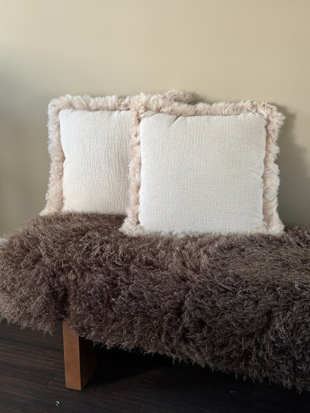 Soft beige cushions lamb curl