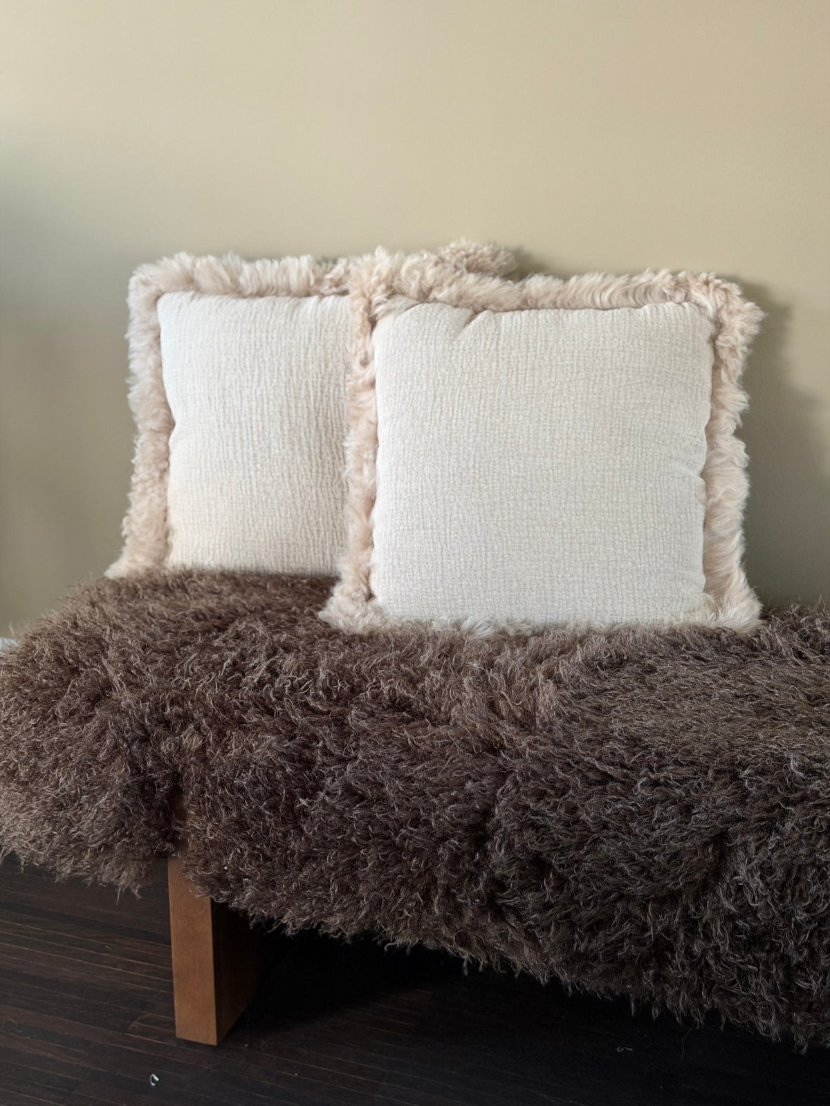 Soft beige cushions lamb curl